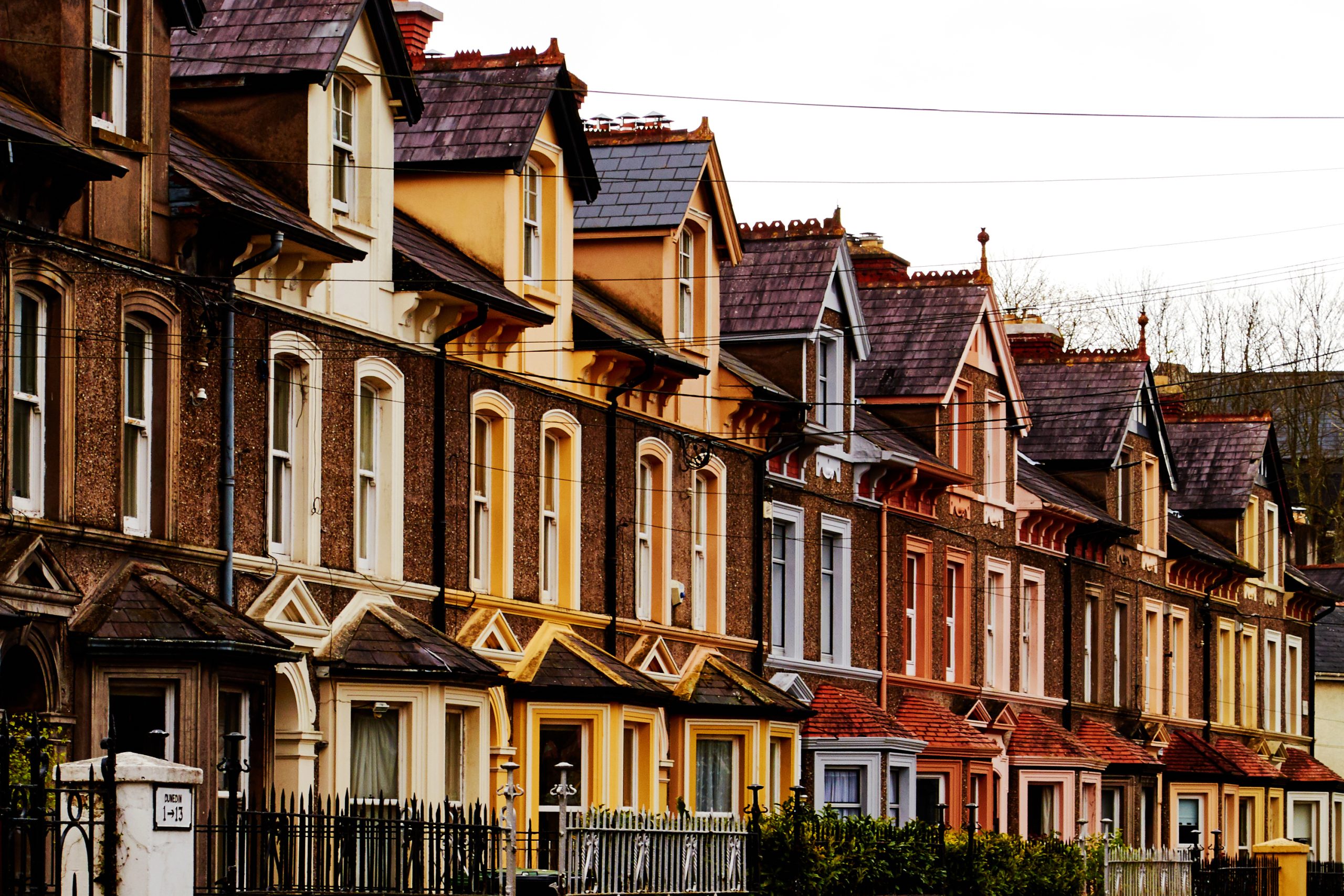 Brightly painted villa houses in the suburbs. Historical places of Europe. Cork, Ireland